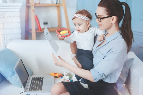 Pretty small child playing with a toy — Stock Photo, Image