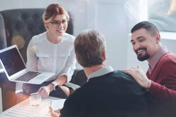 Happy bearded man looking at his colleague — Stock Photo, Image