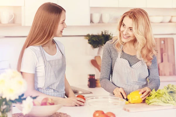 Positive delighted woman looking at her daughter — Stock Photo, Image