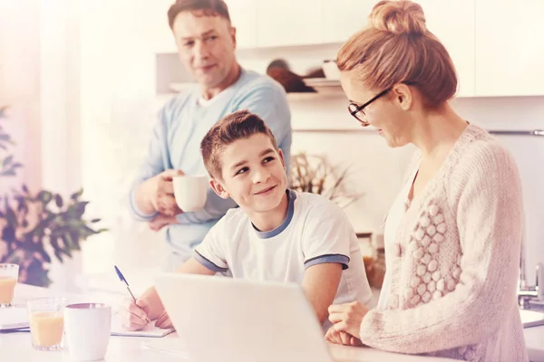 Positive delighted boy doing his lessons — Stock Photo, Image
