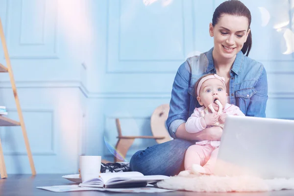 Delighted happy woman looking at the laptop screen — Stock Photo, Image