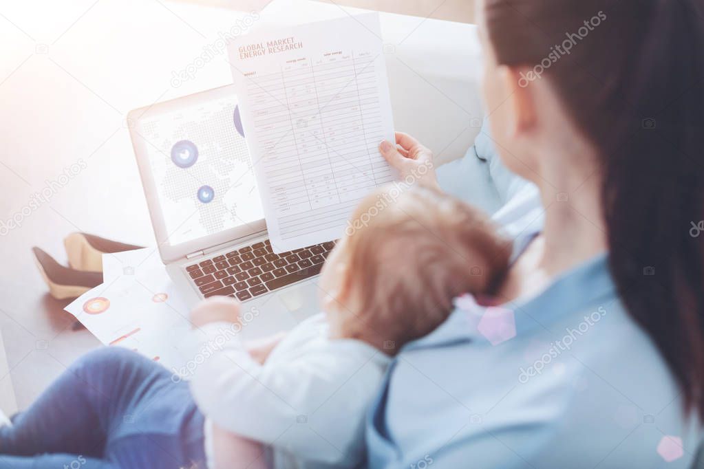 Nice self employed woman working with documents