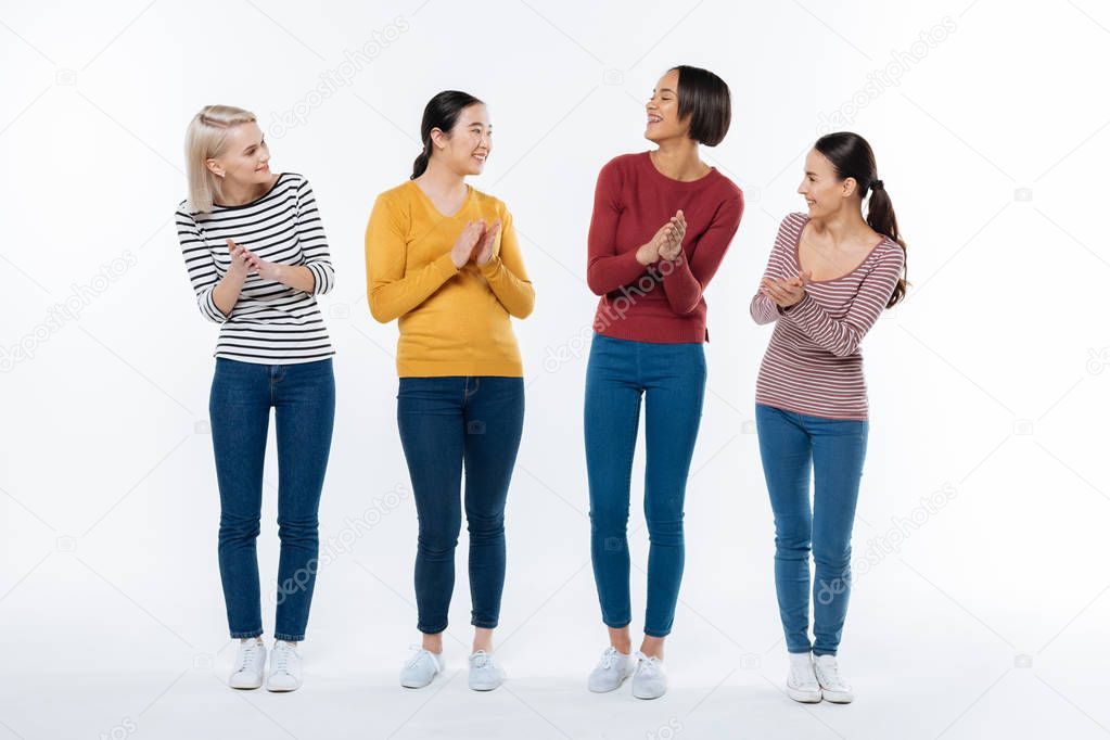 Positive happy women applauding