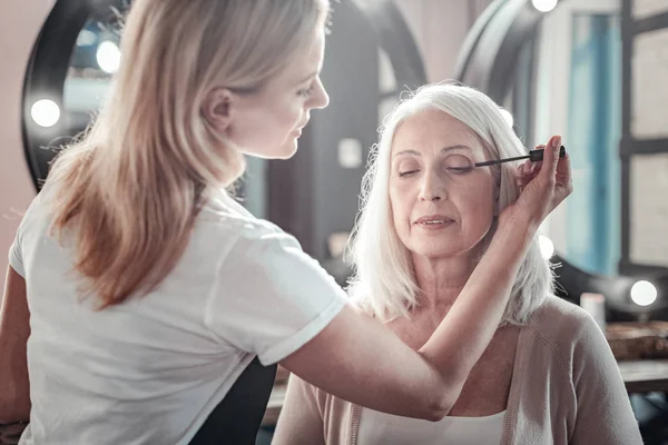 Nice aged woman closing her eyes — Stock Photo, Image