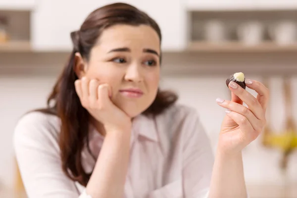 Mournful depressed woman wanting candy — Stock Photo, Image