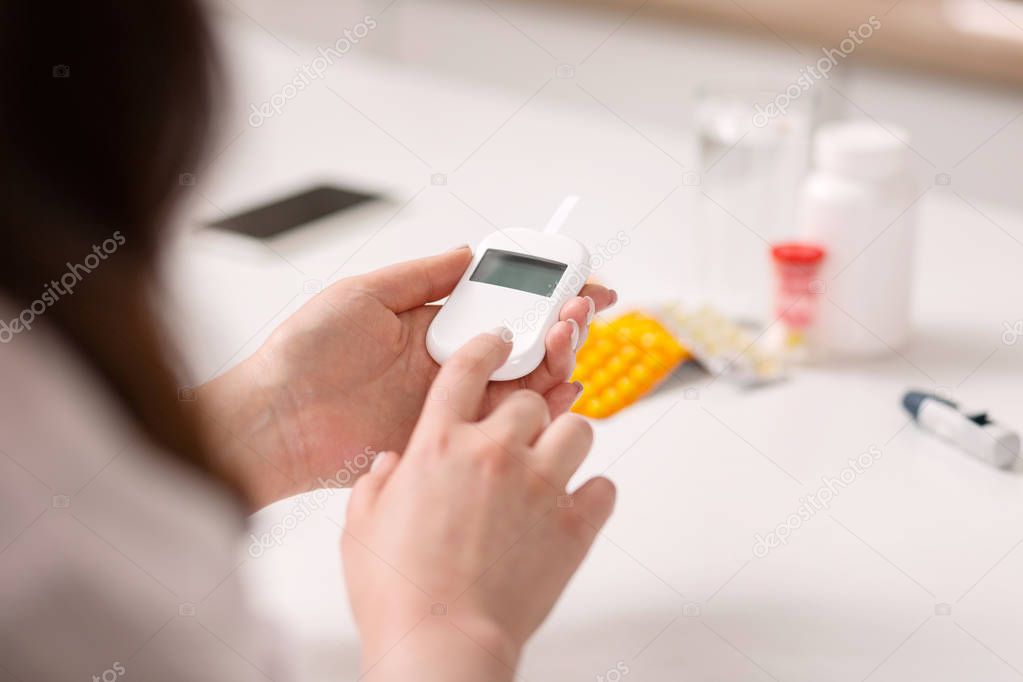 Ill woman controlling blood sugar level