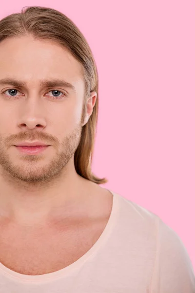 Portrait of pleasant blue-eyed man against pink background — Stock Photo, Image