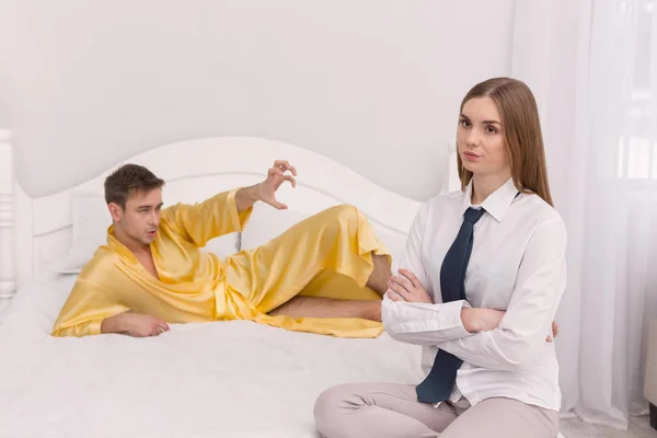 Displeased woman sitting with her arms crossed — Stock Photo, Image