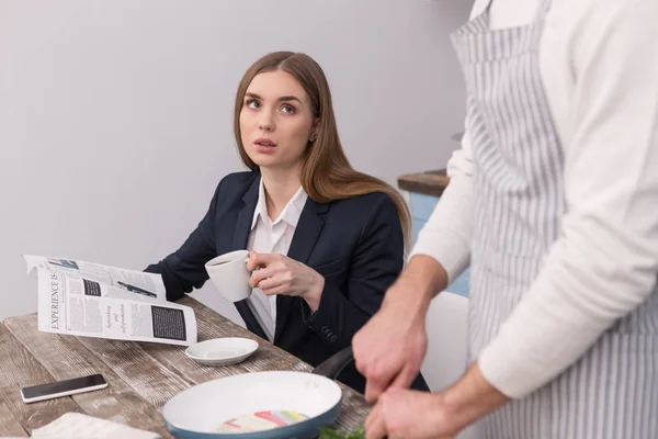 Unsmiling woman having her morning coffee — Stock Photo, Image