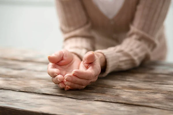 Close up of female hands being held together — Stock Photo, Image