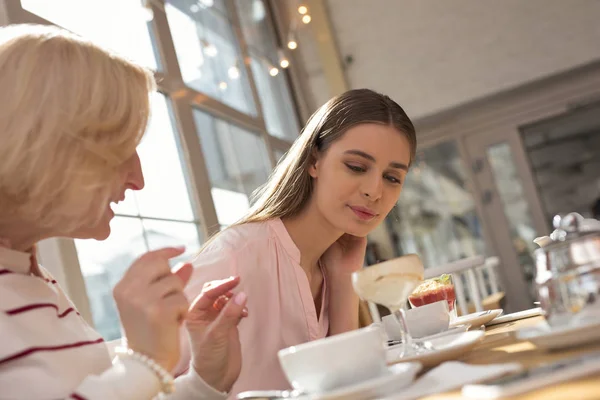 Content girl having lunch with her granny — Stock Photo, Image