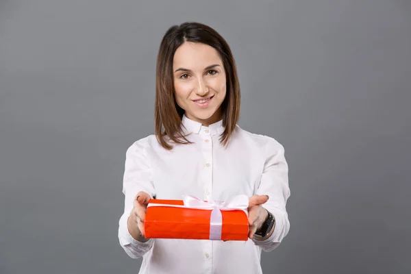 Attractive nice woman giving you the gift — Stock Photo, Image