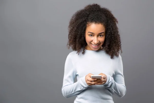 Cheerful young woman using social networks — Stock Photo, Image