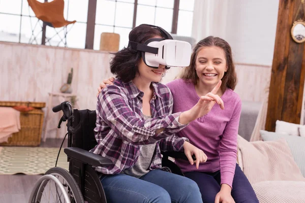 Gay disabled woman and girl studying VR — Stock Photo, Image