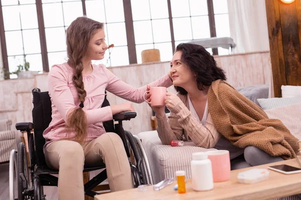 Pleasant handicapped girl and woman talking — Stock Photo, Image