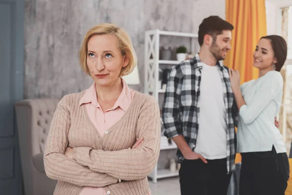 Dissatisfied senior woman standing at home — Stock Photo, Image