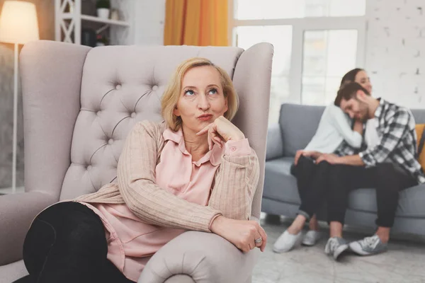 Cheerless skeptical woman sitting in the chair — Stock Photo, Image
