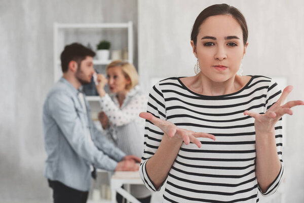 Cheerless young woman gesticulating