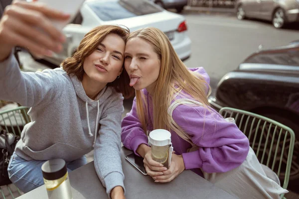 Positive delighted girls making faces on camera — Stock Photo, Image