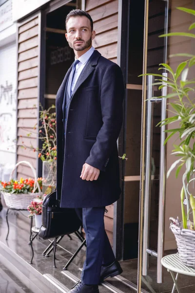 Handsome brunette male person demonstrating his outfit — Stock Photo, Image