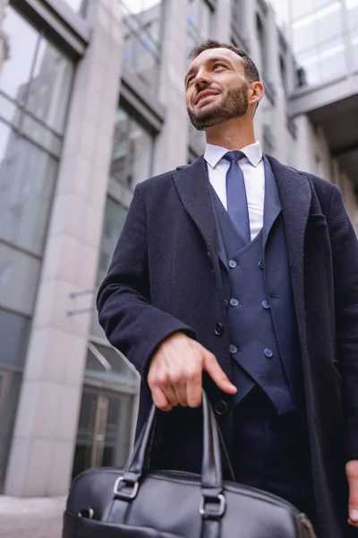 Delighted young man looking at business center — Stock Photo, Image