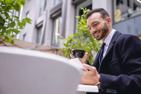 Positive delighted businessman waiting for his partner — Stock Photo, Image