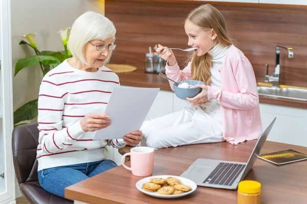 Lady staring at a document in her hands — Stock Photo, Image