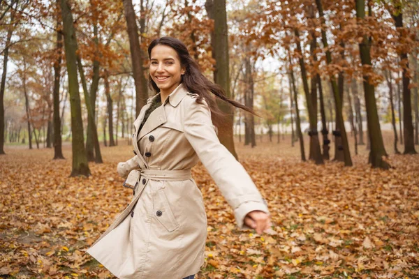 Joyful young woman walking with great pleasure — Stock Photo, Image