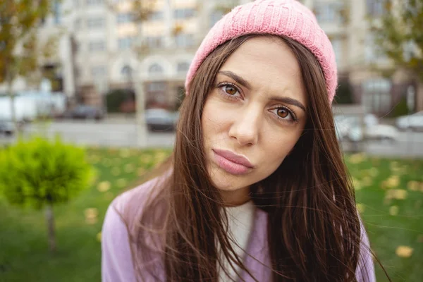 Attentive young long haired woman staring at you — Stock Photo, Image