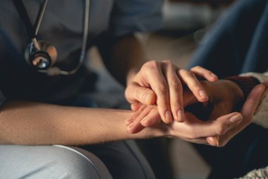 Two females feeling support during health consultation