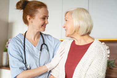 Kind young female person embracing her patient
