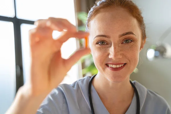 Positive delighted medical worker looking straight at camera — Stockfoto