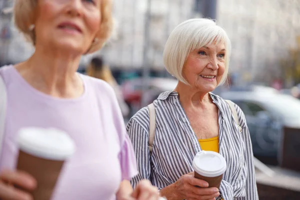 Woman enjoying her stroll with a friend — Stock Photo, Image