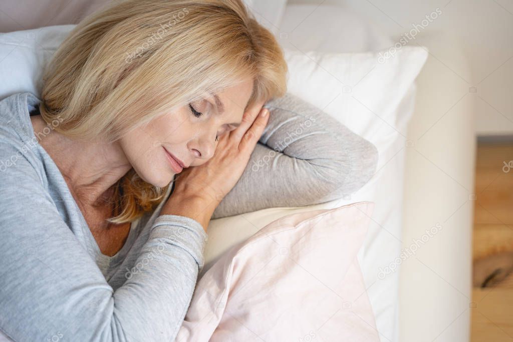 Pleased face of sleeping woman stock photo