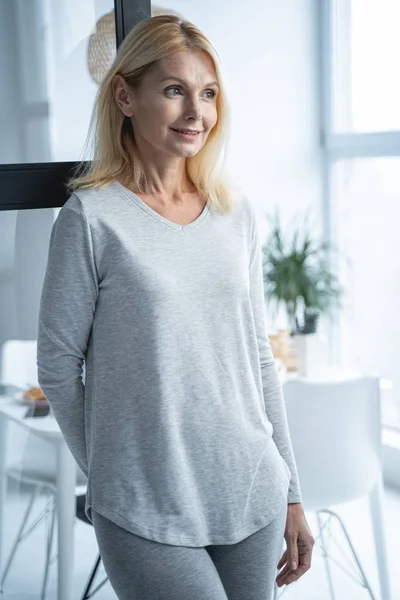 Joyful lady in pajama in dining room stock photo — Stock Photo, Image