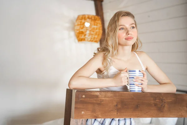 Dreamy blonde girl being deep in her thoughts — Stockfoto