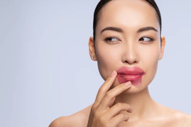 Close up of pretty girl that doing lip mask