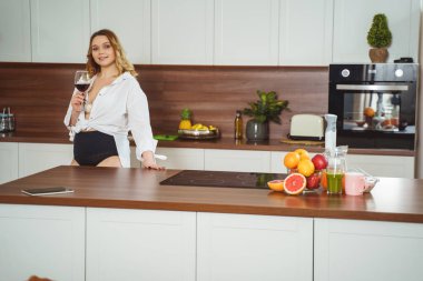 Cheerful plump female looking straight at camera
