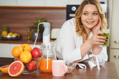 Attractive young female being deep in her thoughts