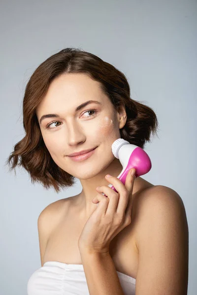 Positive delighted female person washing her face — ストック写真