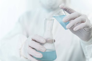Focused photo on hands that holding glass dishes