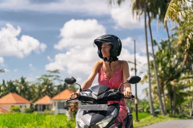 Positive delighted girl enjoying beautiful tropical landscape