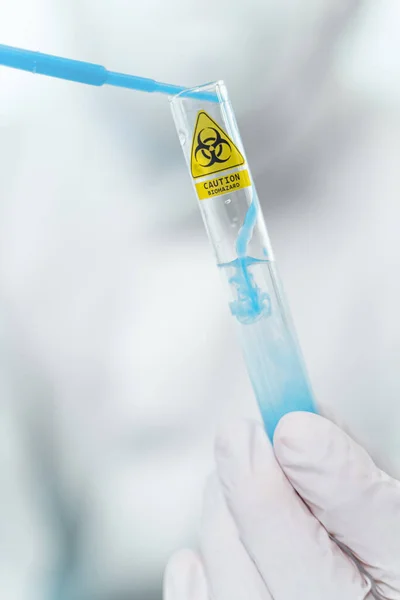 Focused photo on marked test tube with liquid — 图库照片