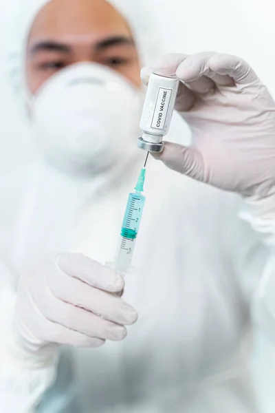 Close up of international scientist that looking at medicine — Stockfoto