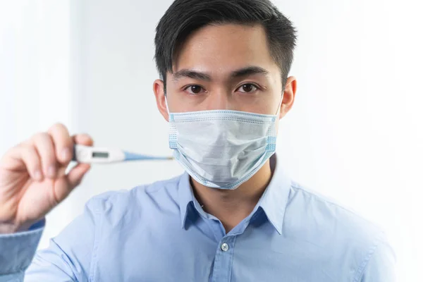 Negative delighted Asian man looking at camera — Stockfoto