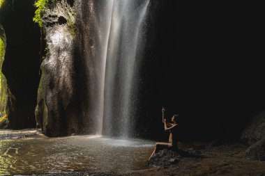 Relaxed young female meditating in silent place