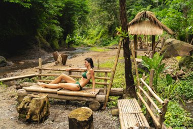 Pleased young woman enjoying her summer vacation