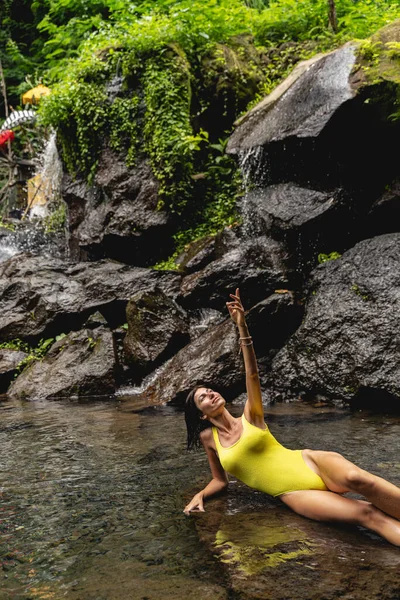 Positive delighted young woman enjoying wild nature — 스톡 사진