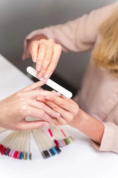 Close up of manicure master that correcting nail — Stock Photo, Image