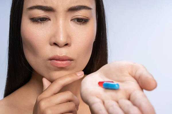 Portrait of beautiful young lady holding vitamin — Stock Photo, Image